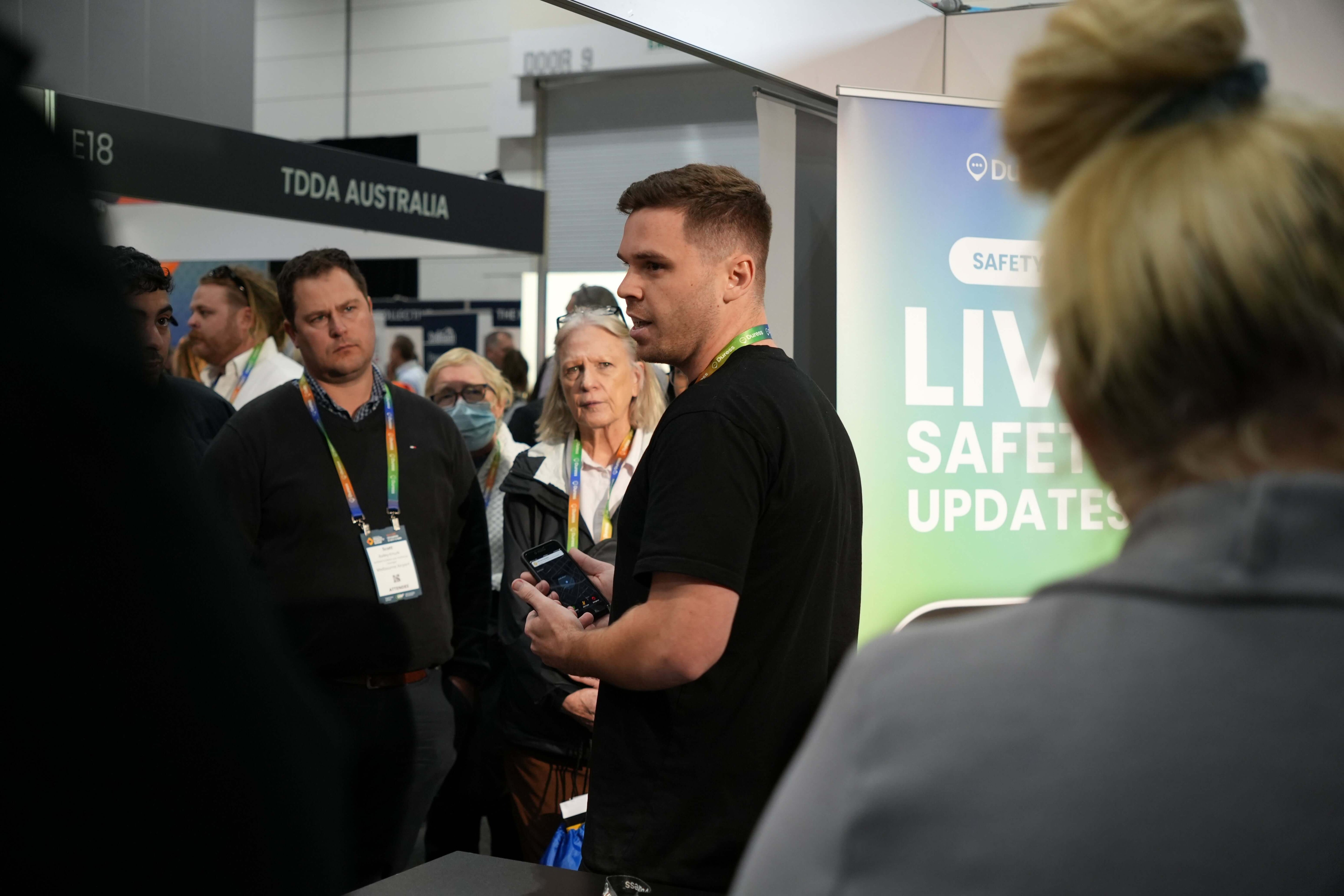 Duress Partnerships Team doing a live demo at the tradeshow in front of interested employers who want to keep their team safe