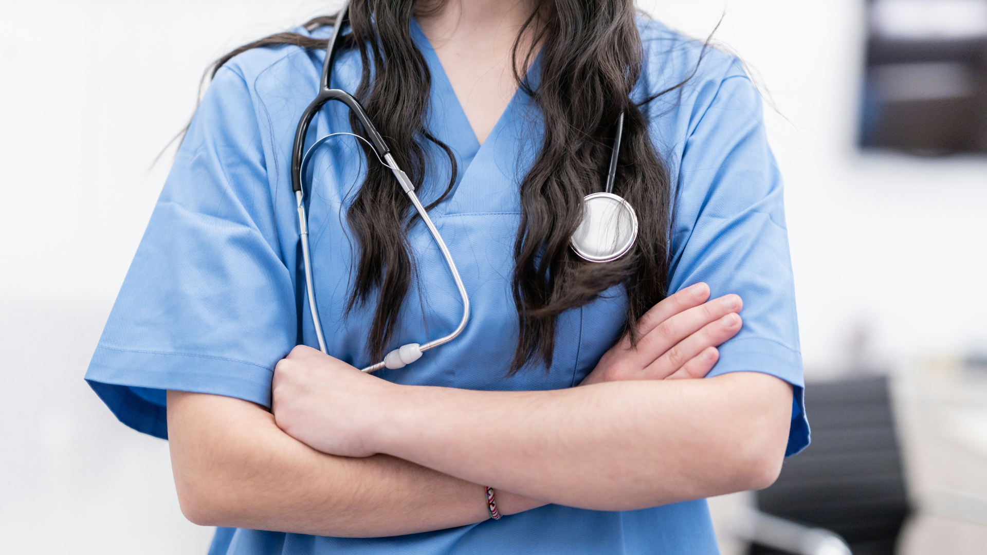 Frontline doctor crossing arms with equipment 